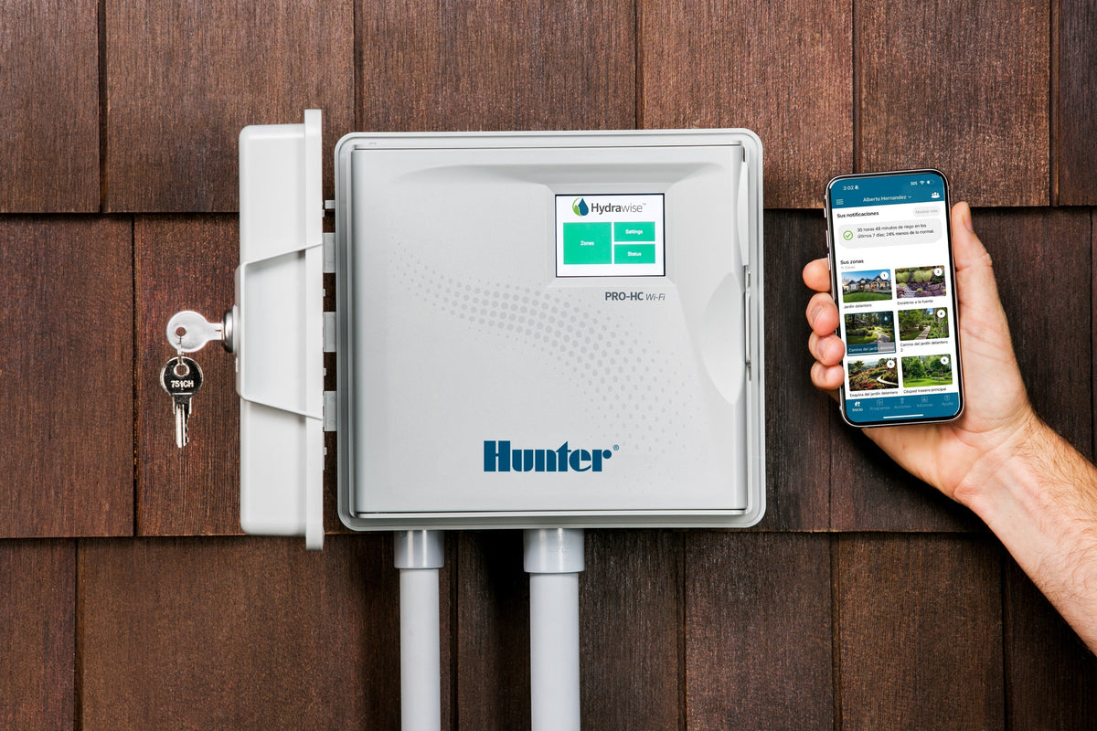  Hunter Pro-HC Wi-Fi irrigation controller mounted outdoors, managed remotely with Hydrawise mobile app scheduling