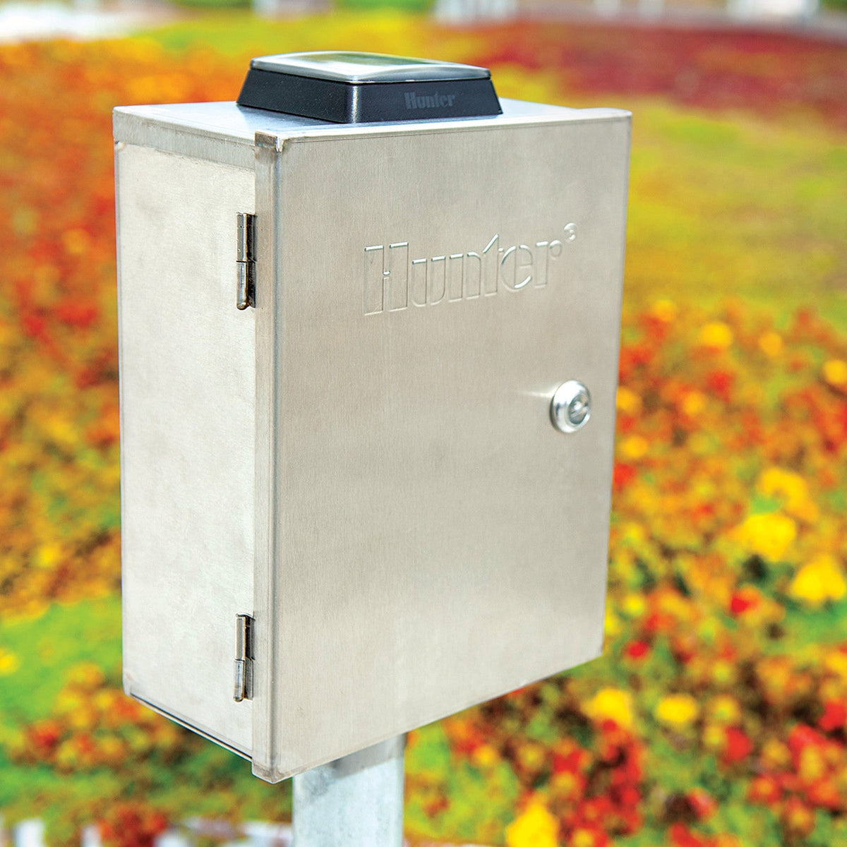 Metal box with 'Hunter' branding on a grassy background
