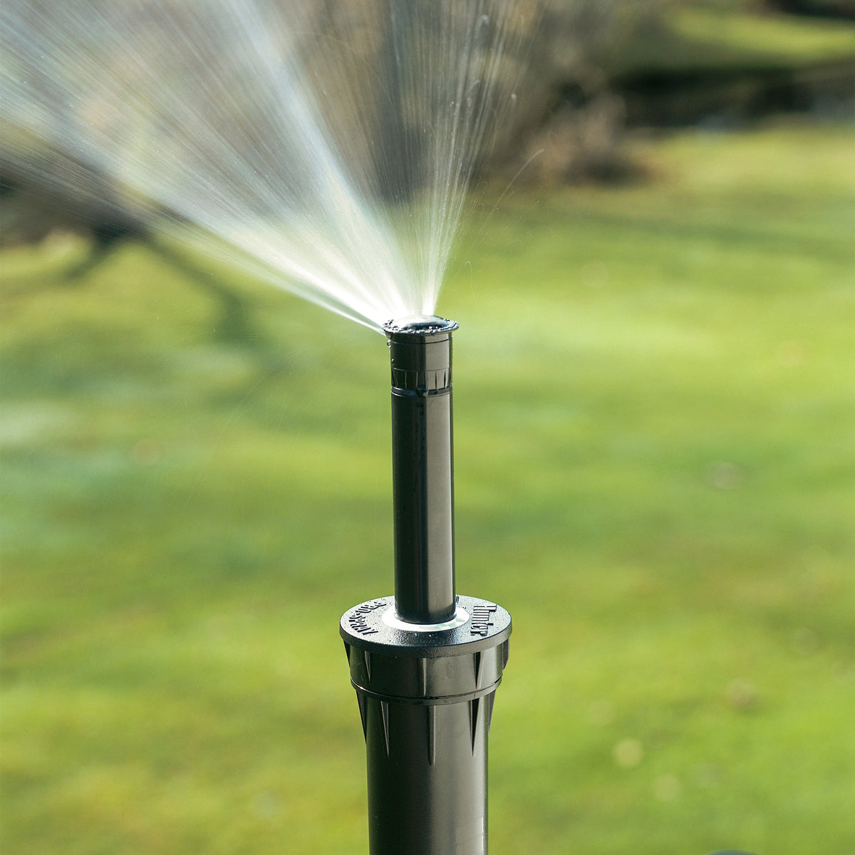 Hunter Pro-Spray pop-up adjustable sprinkler installed in use on lawn
