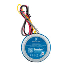 Round blue Hunter Node Bluetooth battery-powered irrigation controller with attached multicolored wires and a black clip.