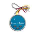 Round blue and gray Hunter Node Bluetooth battery-powered irrigation controller with wires and three black buttons.