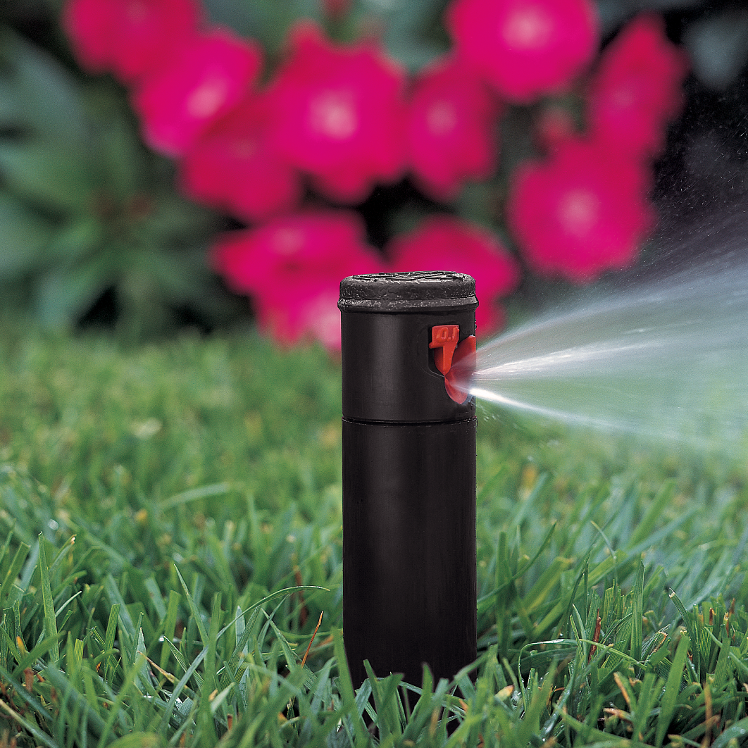 Hunter PGJ adjustable 4-inch rotor sprinkler installation photo in use on lawn red 1.0 nozzle