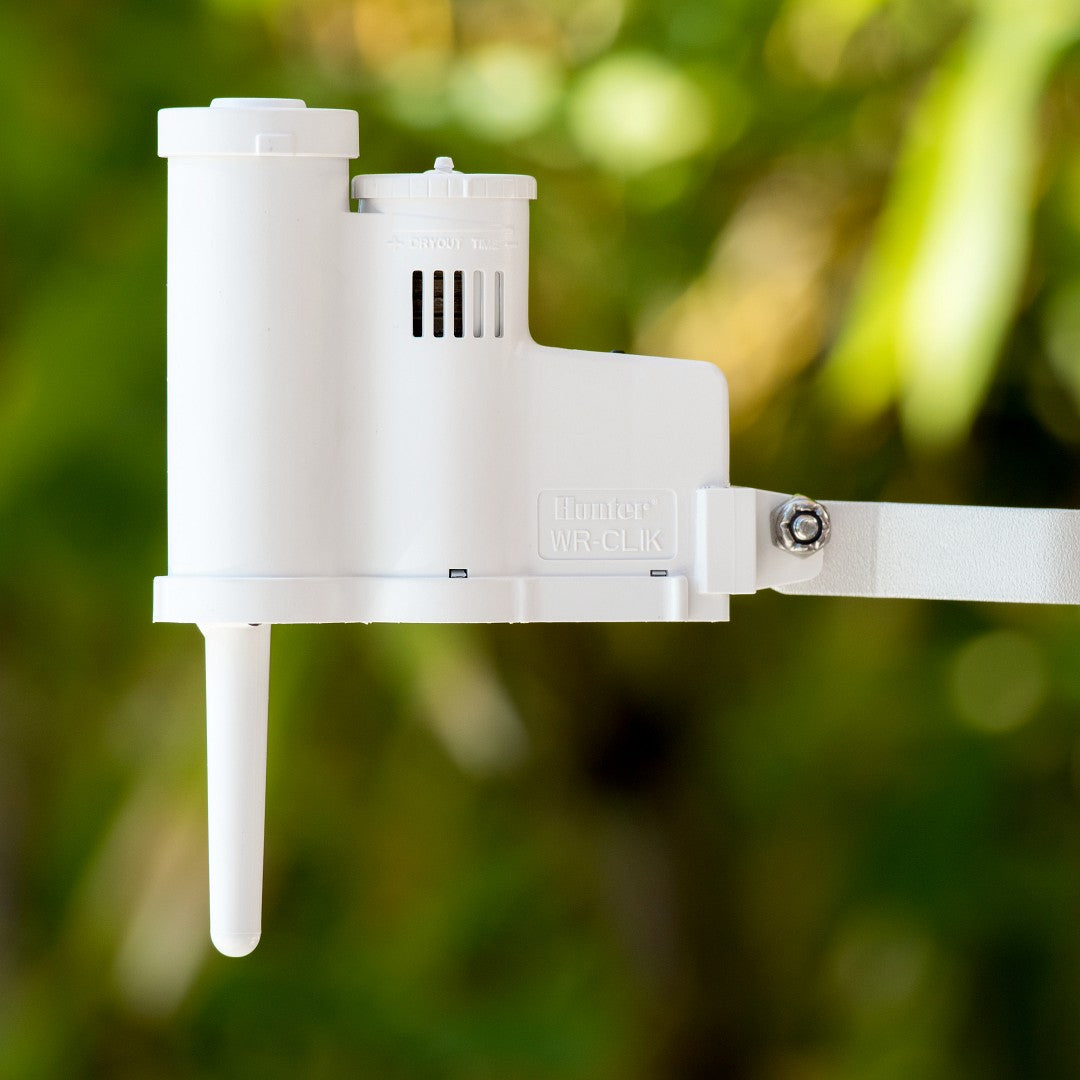 Hunter Wireless Rain Clik sensor installed outdoors closeup image